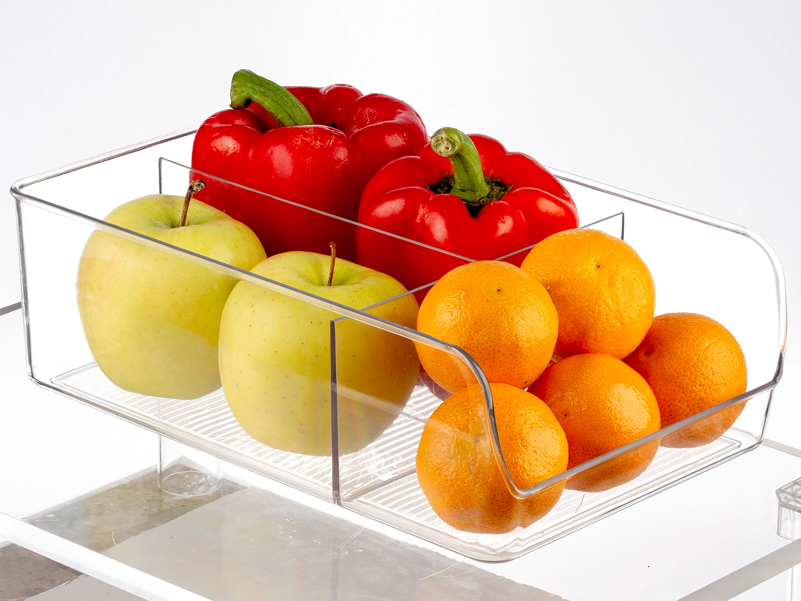 Apples and oranges in clear plastic box product retouching