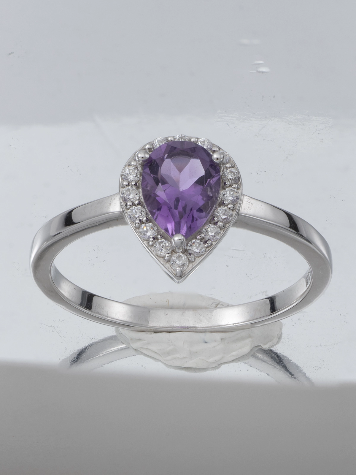 Color correction and gemstone retouching for silver amethyst ring portfolio