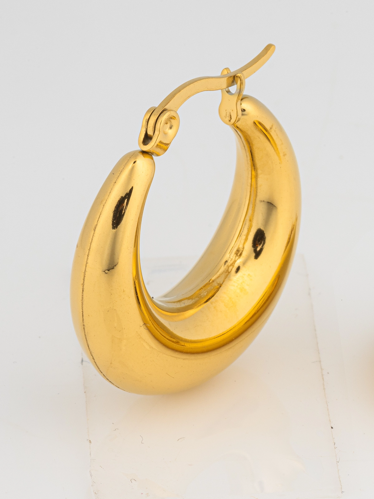 E-commerce jewelry image editing for gold hoop earrings on white background