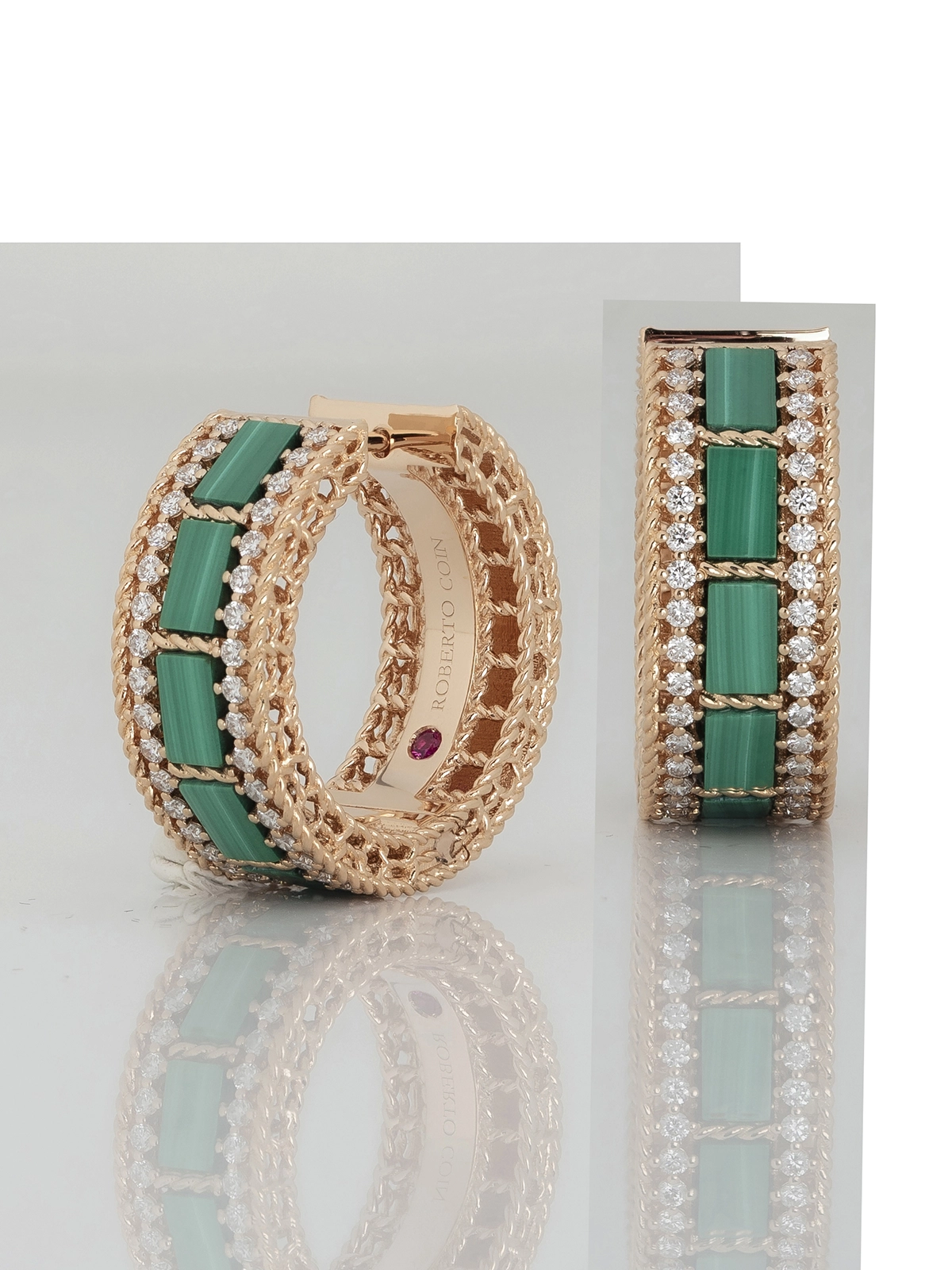 Detailed jewelry retouching for emerald hoop earrings with focus stacking