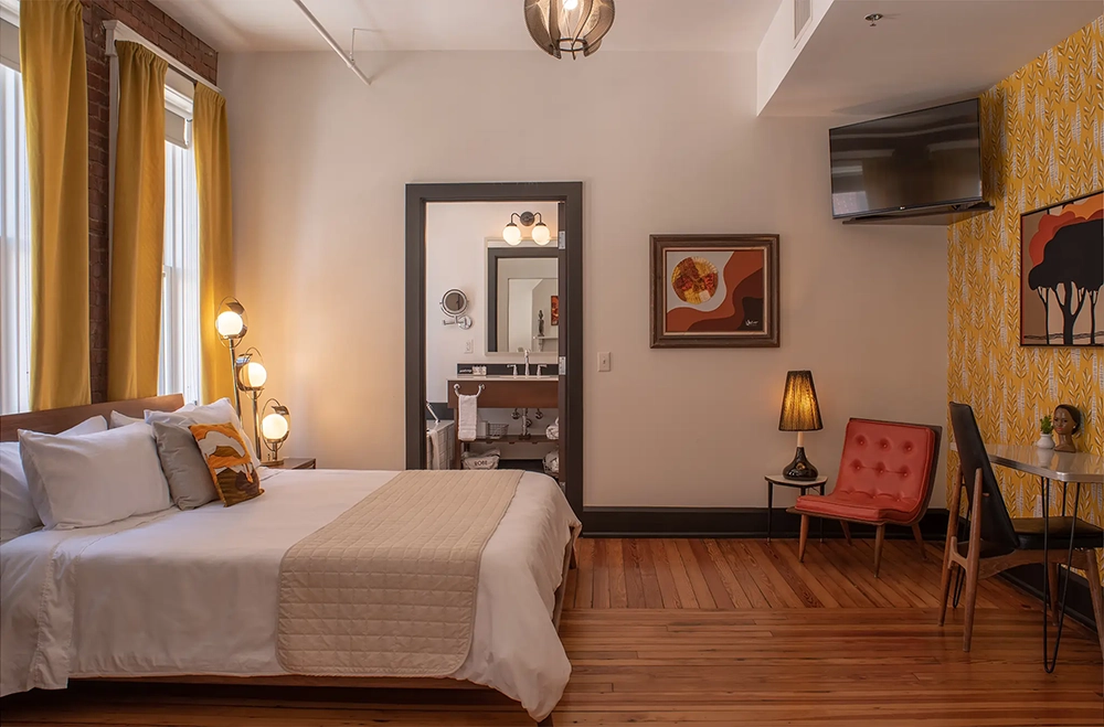 Expert real estate photo editors for hotel room enhancement.